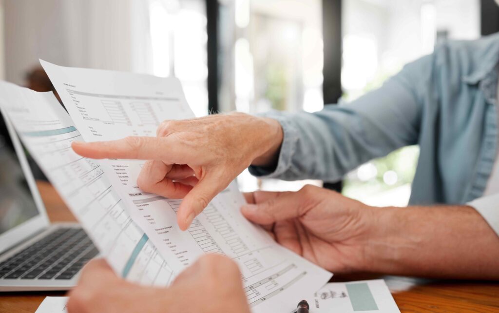 A business owner being shown a report from their bookkeeper